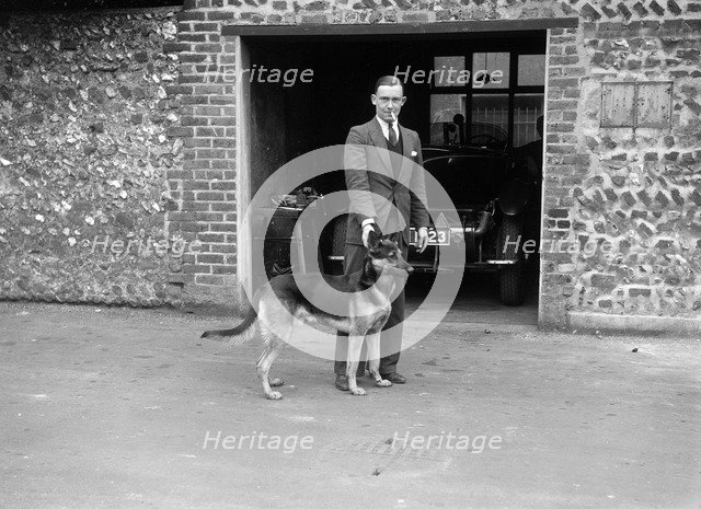 Geoffrey Baker and his alsatian. Artist: Bill Brunell.