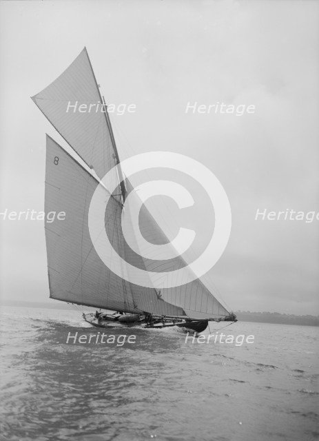 The 45 ton cutter 'Camellia' sailing close-hauled, 1911. Creator: Kirk & Sons of Cowes.