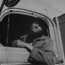 Truck driver for the Alaska Coal Company, Washington, D.C., 1942. Creator: Gordon Parks.