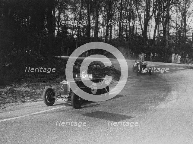 Two Frazer-Nash cars racing at Donington Park, Leicestershire, 1930s. Artist: Bill Brunell.