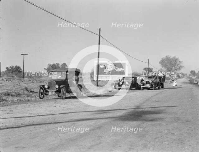 Three carloads of Mexicans headed for the Imperial Valley to harvest peas, near Bakersfield, CA,1936 Creator: Dorothea Lange.