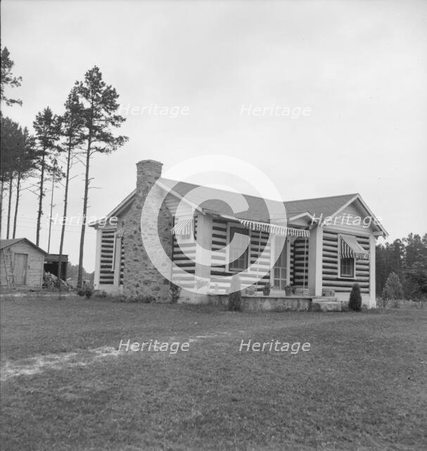 A new very fancy log bungalow..., near Gordonton, North Carolina, 1939. Creator: Dorothea Lange.