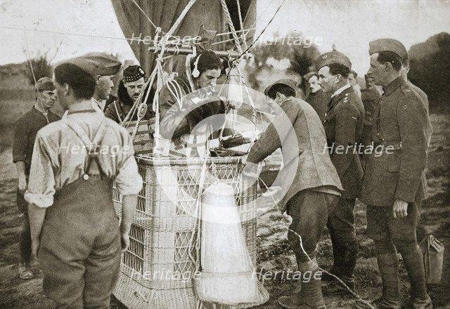 Observer of a kite-balloon testing the telephone before ascending, France, World War I,1916. Artist: Unknown