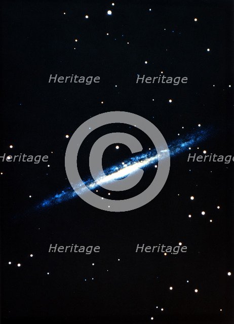 Spiral galaxy viewed edge on. Artist: Unknown