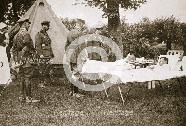 King George V conversing with wounded officers, France, World War I, 1916. Artist: Unknown