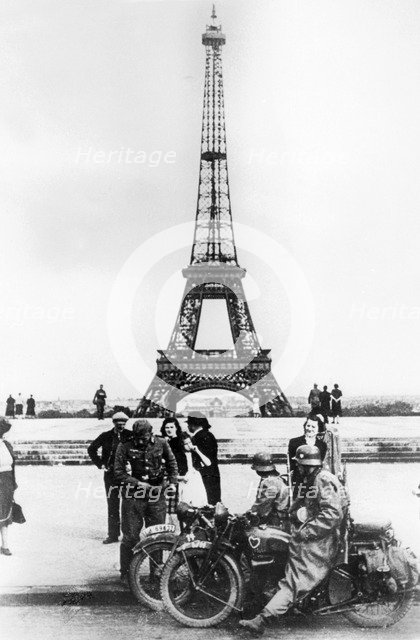 German soldiers in front of the Eiffel Tower, Paris, 1940. Artist: Unknown
