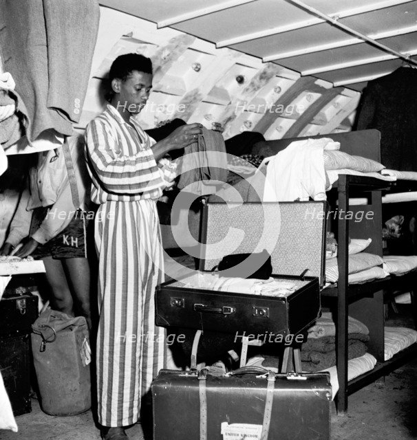 West Indian arrivals living in a shelter underneath Clapham South Tube station, London, 1950s.  Creator: Henry Grant.