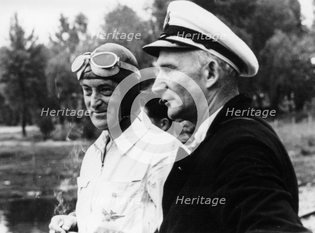 Sir Malcolm Campbell, on the left, possibly at Coniston, 1939. Artist: Unknown