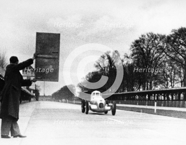 Rudolf Caracciola driving Mercedes-Benz W25 Streamliner car, 1934. Artist: Unknown