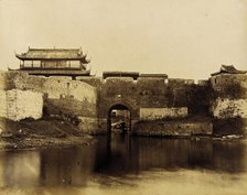 Walled River and Bridge with Buildings Above, 1860. Creator: Felice Beato.