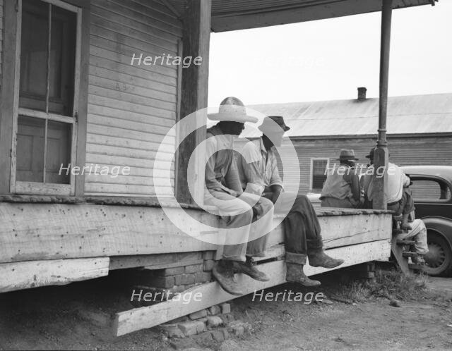 Storefront loafers, Mississippi Delta, 1936. Creator: Dorothea Lange.