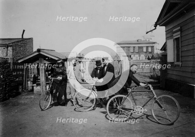 Cyclists in the courtyard of the estate, 1900. Creators: V. I. Podgorbunskii, I. A. Podgorbunskii.
