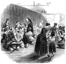 Teaching girls to read in the Ragged School Union school, Lambeth, London, 1868. Artist: Unknown