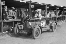 Clive Gallop and Leon Cushman's Aston Martin in the pits, JCC Double Twelve race, Brooklands, 1931. Artist: Bill Brunell.