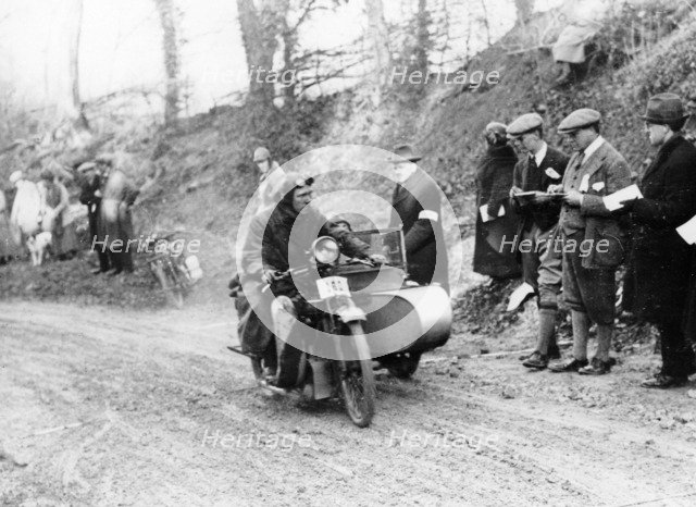 A competitor riding a Norton, competing in the Colmore Cup Trial, 1921. Artist: Unknown