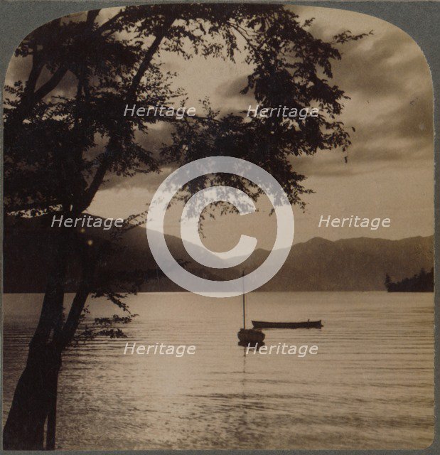 'Setting sun, over Lake Chuzenj, lying within its mountain walls, Japan', 1904.  Artist: Unknown.