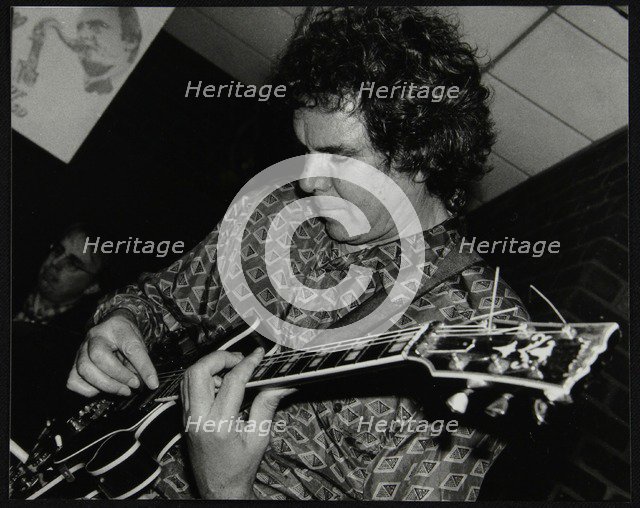 Guitarist John Etheridge playing at The Fairway, Welwyn Garden City, Hertfordshire, 9 November 2003. Artist: Denis Williams