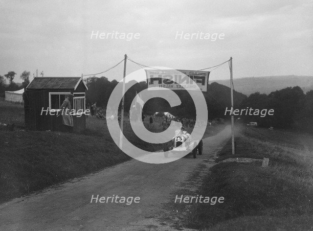 Unidentified offset single-seater car finishing the Shelsley Walsh Hillclimb, Worcestershire, 1935. Artist: Bill Brunell.