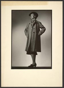 Woman modeling coat, early 1940s. Creator: Gunther Krampf.