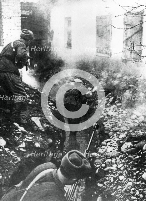 Russian troops liberating a village near Ordhonikidze, Caucasus, 1942. Artist: Unknown