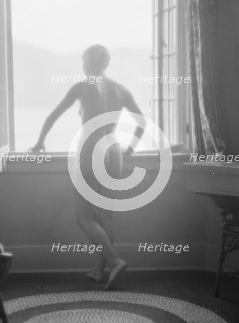 Lee, Margaret, Miss, standing at a window, 1927 Creator: Arnold Genthe.