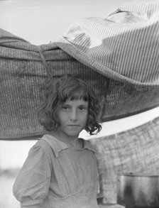 Migratory child in camp at end of day, Bean pickers' camp near West Stayton, Oregon, 1939. Creator: Dorothea Lange.