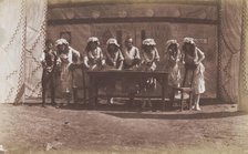 British servicemen in drag acting out a cooking class, 1918. Creator: Unknown.