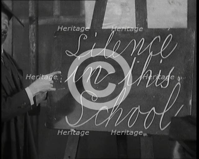 The Entertainer Will Hay Writing on a Blackboard, 1920s Creator: British Pathe Ltd.