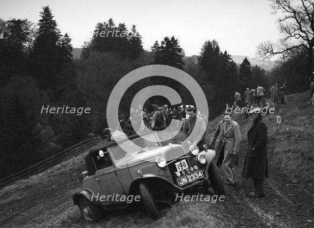 Ford V8 of H Koppenhagen competing in the MCC Edinburgh Trial, Roxburghshire, Scotland, 1938. Artist: Bill Brunell.