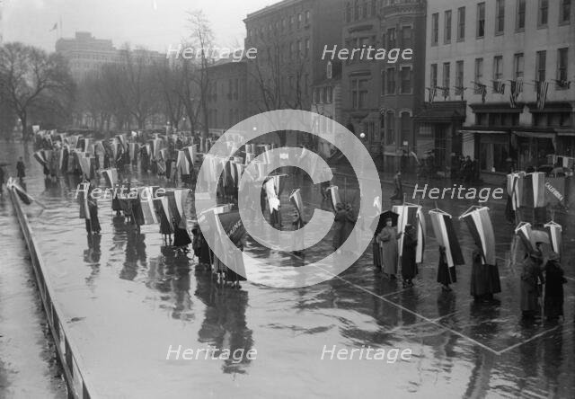 Woman Suffrage - Marching in Rain, 1917. Creator: Harris & Ewing.