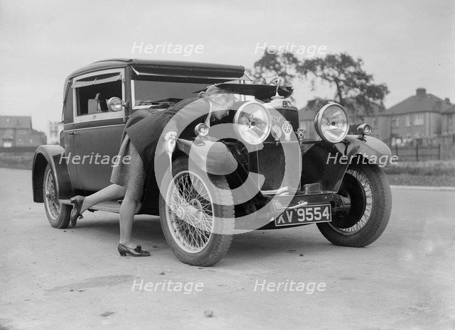 Kitty Brunell looking under the bonnet of a Talbot 14/45 sportsman's coupe, c1928. Artist: Bill Brunell.
