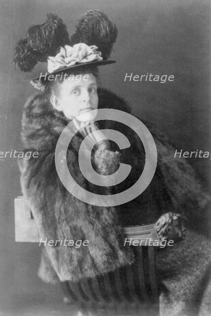 Frances Benjamin Johnston, 1864-1952, half length, seated, facing right, wearing fur jack..., 1890s. Creator: Frances Benjamin Johnston.