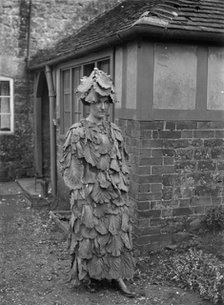 A woman in a cabbage leaf costume, Hellidon, Northamptonshire, c1896-c1920. Artist: A Newton