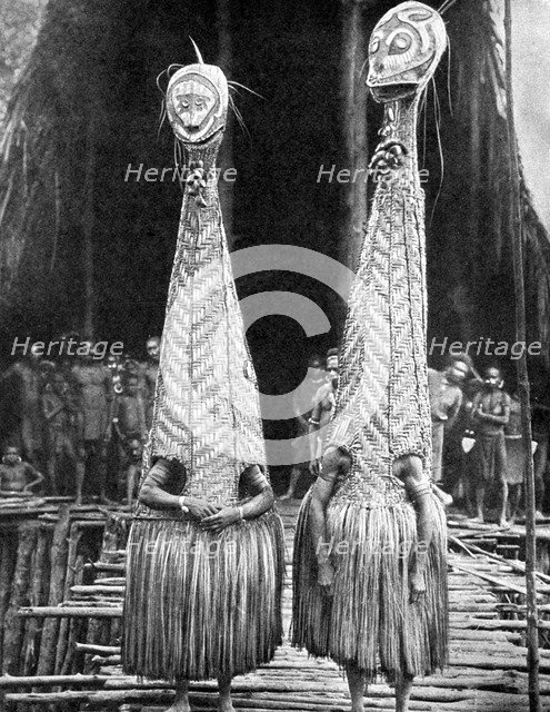 Goblin masks and visors worn as beauty aids, Papua, New Guinea, 1936.Artist: Fox Photos