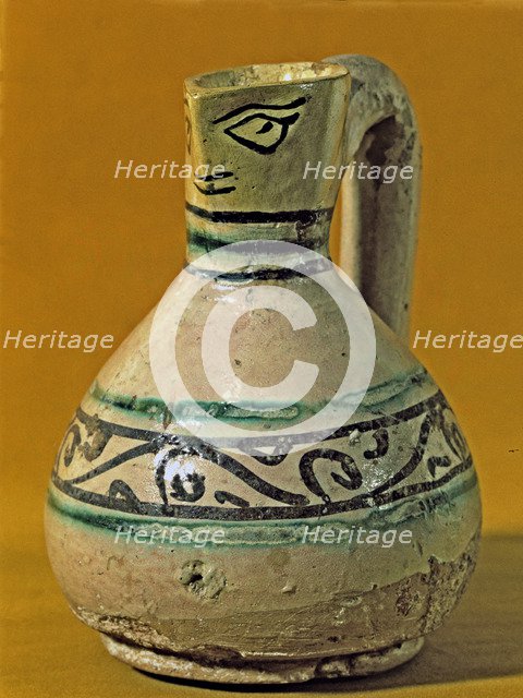 Vase with scoop anthropomorphic shaped decorated in green and black. Manresa pottery discovered i…