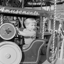 Child on a fairground ride, Hampstead, London, 1962-1964. Artist: John Gay