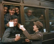 British Soldiers Receiving Food and Drink on the Train Back To Camp, 1940. Creator: British Pathe Ltd.