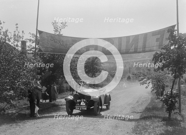 Invicta of D Munro at the finish of the BOC Hill Climb, Chalfont St Peter, Buckinghamshire, 1932. Artist: Bill Brunell.