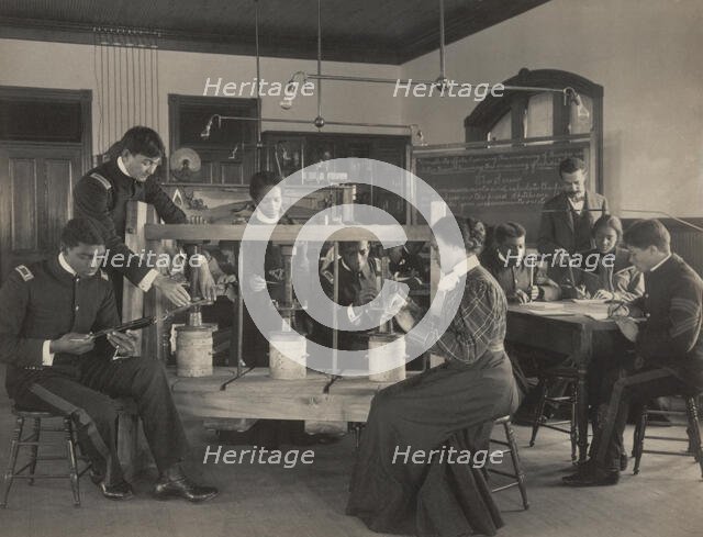 The cheese press screw - students studying agricultural sciences, Hampton Institute..., 1899 or 1900 Creator: Frances Benjamin Johnston.
