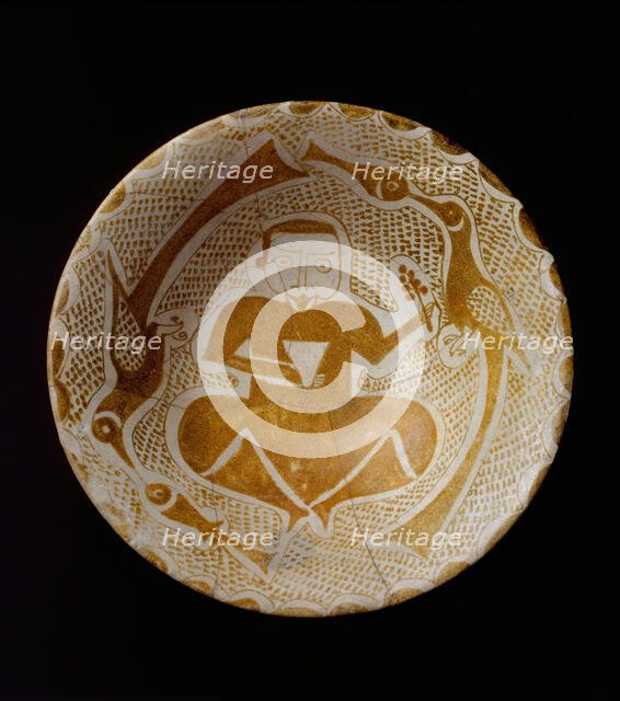Bowl depicting a Man holding a Cup and a Flowering Branch, Iraq, 10th century. Creator: Unknown.