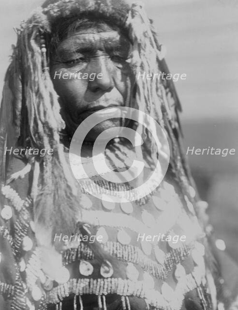 Wife of Weasel Head-Piegan, c1910. Creator: Edward Sheriff Curtis.