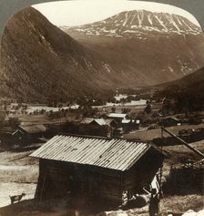 'Snowy heights of Mt. Gausta (6180 ft.), above quiet homes in Maan Valley, Norway', c1905. Creator: Unknown.
