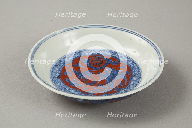Red clobbered blue and white saucer with stork, phoenix and dragons, Jiajing (1522-1566). Artist: Unknown.