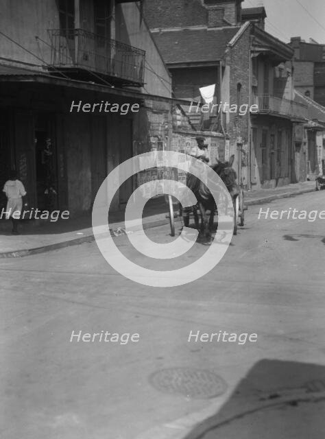 Street scene in the French Quarter, New Orleans, between 1920 and 1926. Creator: Arnold Genthe.