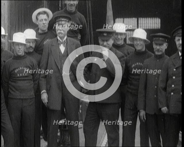 Sir Thomas Lipton Standing With the Crew of the Ship 'The Shamrock', 1920. Creator: British Pathe Ltd.