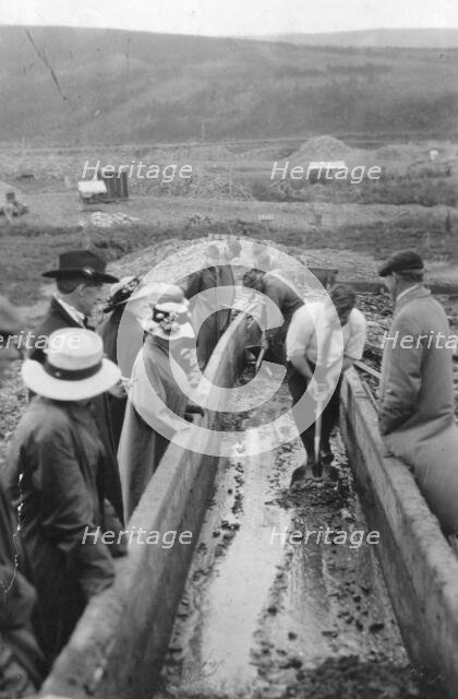 Taking gold from Chatanika, sluice-box, between c1900 and c1930. Creator: Unknown.
