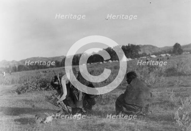 Offering pipe to the skull-Cheyenne, c1910. Creator: Edward Sheriff Curtis.