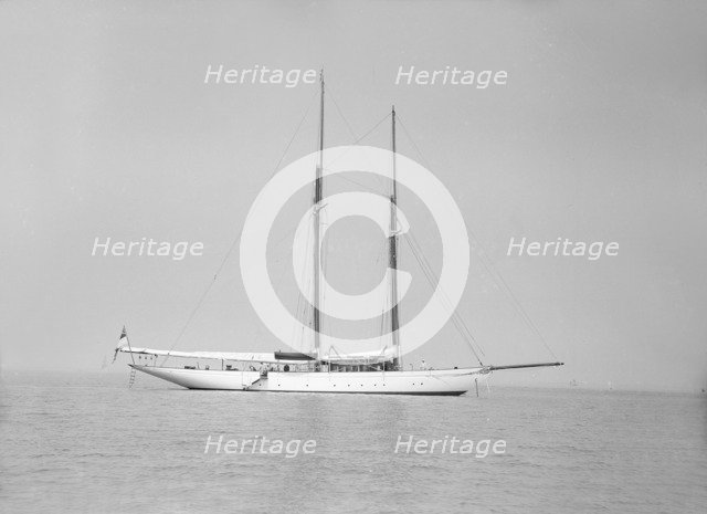The schooner 'Joyance' at anchor, 1913. Creator: Kirk & Sons of Cowes.