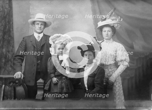 Portrait of unknown family, 1906. Creator: Robert Augustus Henry L'Estrange.