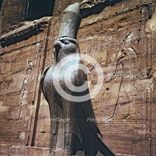 Sculpture of the god Horus at the Edfu temple entrance in Egypt.